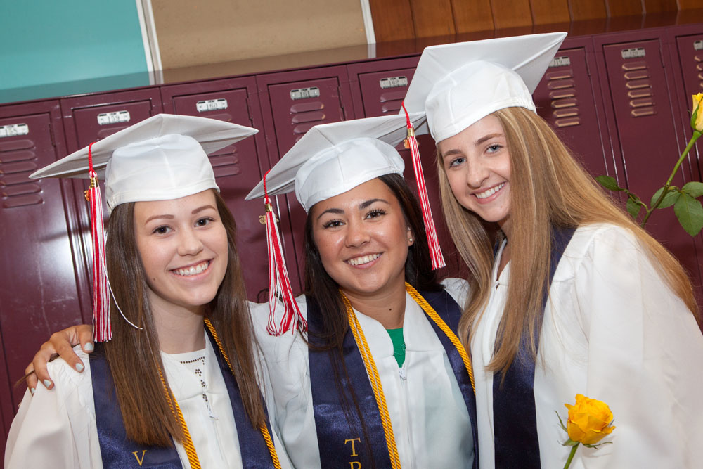 Waiting to enter the auditorium are, from left, Julia Schade, Kimiko Jujita, Paige Messana. (Credit: Katharine Schroeder)