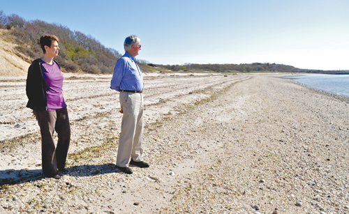 TIM KELLY FILE PHOTO | Doris and Peter McGreevy of Mattituck survey the stretch of Long Island Sound beach east of Mattituck Inlet that will be rebuilt with material dredged from the inlet.