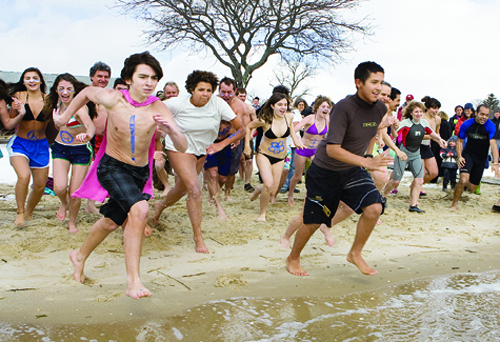 Intrepid souls hit the water at the start of the 2010 Peconic Plunge to benefit Maureen’s Haven at Veterans Memorial Park in Mattituck. (Katharine Schroeder file photo) 