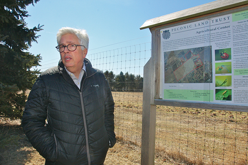 Peconic Land Trust vice president Timothy Caufield at the first property purchased for the group's ag center, the Charnews farm at 3005 Youngs Avenue in Southold. (Credit: Barbaraellen Koch)