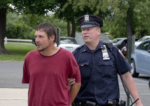 Timothy Stepp, 48, is led into the Southold Town court before his arraignment on felony drug charges Wednesday. (Credit: Paul Squire)