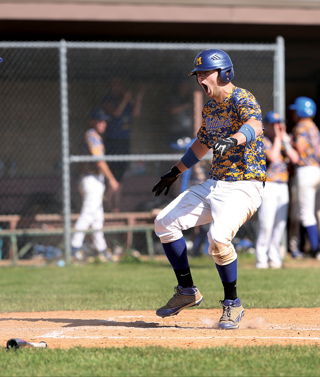 Chris Dwyer (right) meets Maros Perivolaris (left) at home plate after Ian Nish knocked them home with his single. Mattituck Captured its first State Championship by defeating Livonia 4-1 in the NY State Class B Baseball Championship game at SUNY Broome on 6-13-15.Daniel De Mato