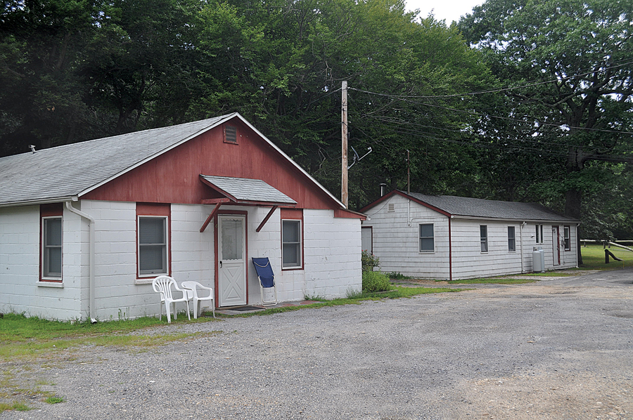 Two of four buildings that house six numbered apartments at the Cutchogue business property where town officials say people are living illegally. Residents there, who pay more than $1,000 a month, say they can't afford anywhere else.