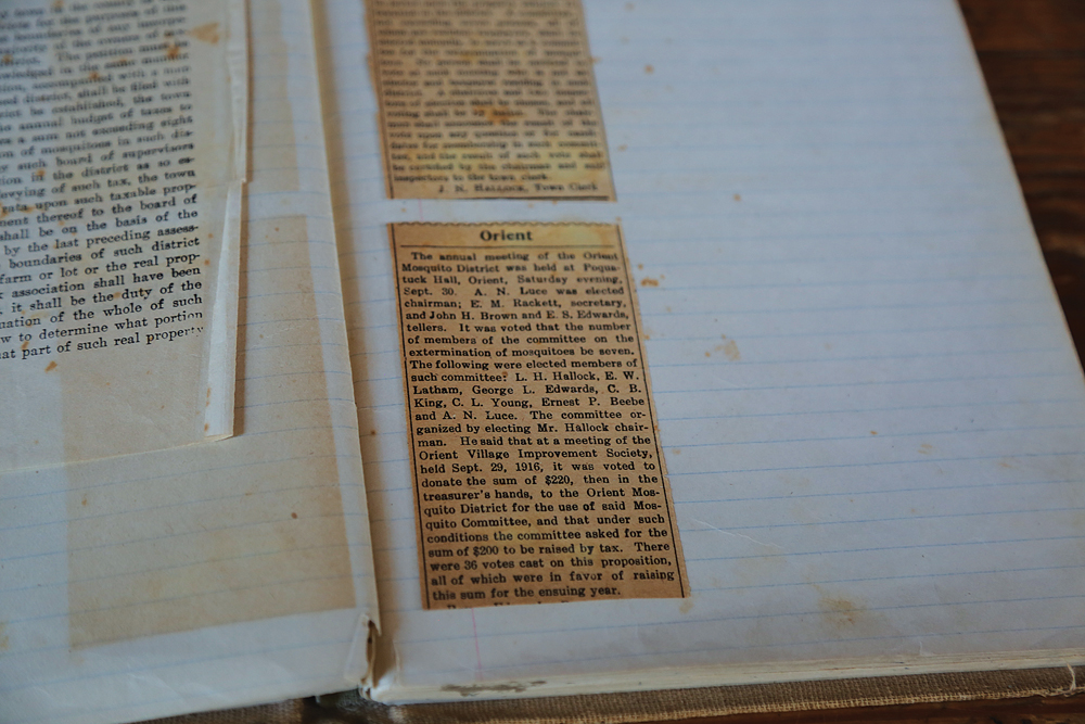 Mr. Hughes brought a book containing 1916 news stories about the district's creation to Saturday's meeting. (Credit: Grant Parpan)