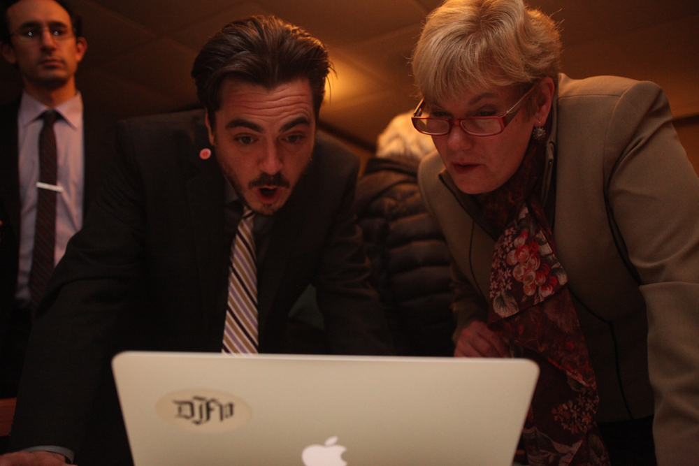 Candidates Damon Rallis and Debra O'Kane took over a reporter's computer for a moment to look at results. (Credit: Chris Lisinski)