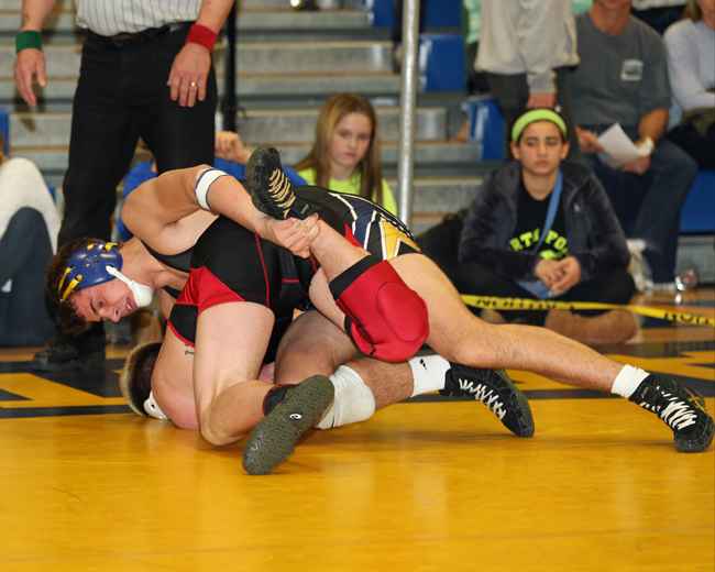 James Hoeg of Mattituck wrestles John Lepak of Connetquot in last week's North Fork Invitational. Mattituck defeated Center Moriches Friday in the final league dual meet. (Credit: Daniel De Mato, file)