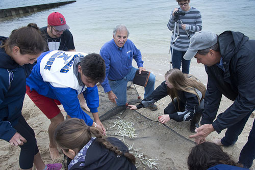 Mel Morris (center) works with students, educating them about the local environment. (Credit: Courtesy)