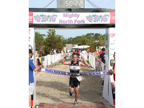 DANIEL DE MATO PHOTO | Shawn Fitzgerald of Cutchogue took the lead with about a half-mile to go and held it to the finish line for his first triathlon victory.