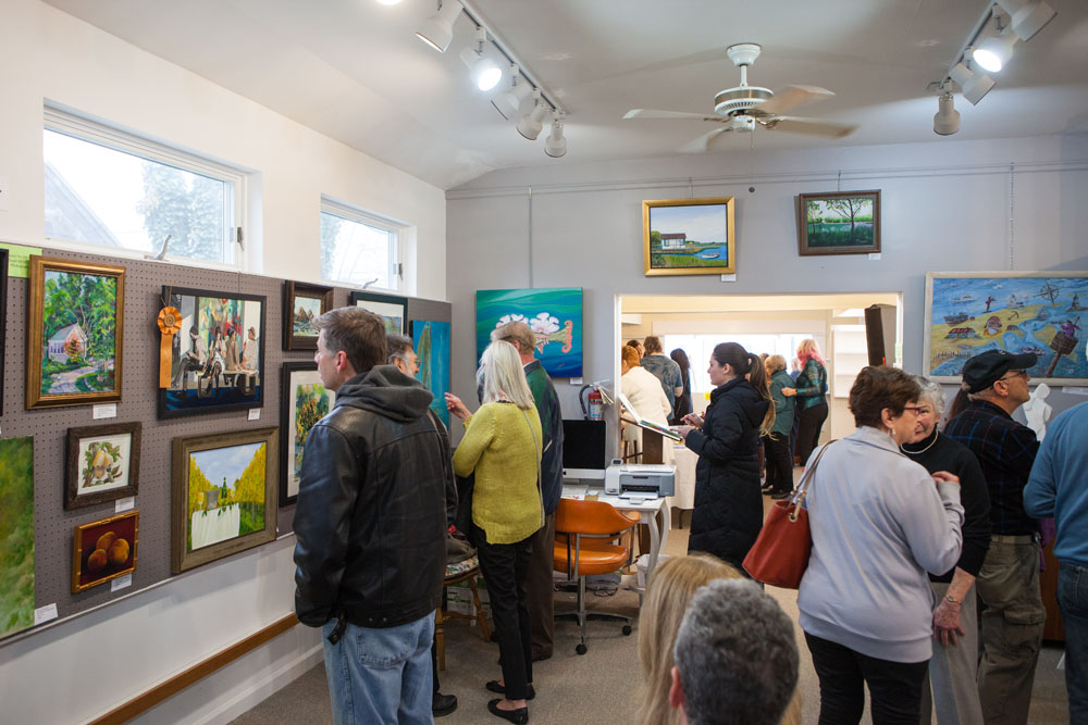 Visitors enjoying the beautiful artwork.