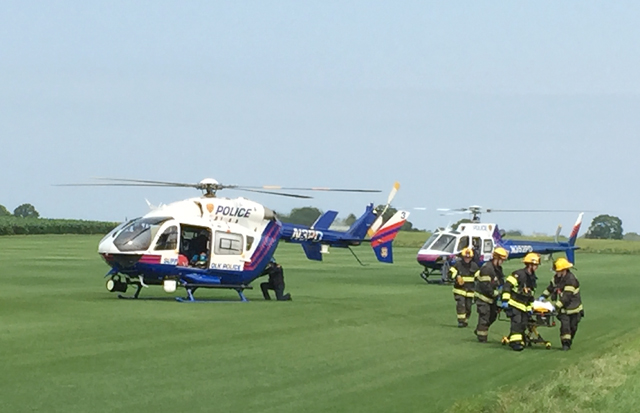 Two Suffolk County police helicopters landed in Cutchogue Wednesday morning. (Credit: Paul Squire)