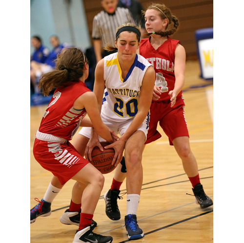 Mattituck junior Katie Hoeg fights for possession against Southold/Greenport sophomore Toni Esposito. (Credit: Garret Meade)