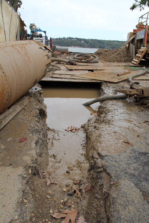 Contractors dug a hole in order to drill to Shelter Island. (Credit: Carrie Miller)